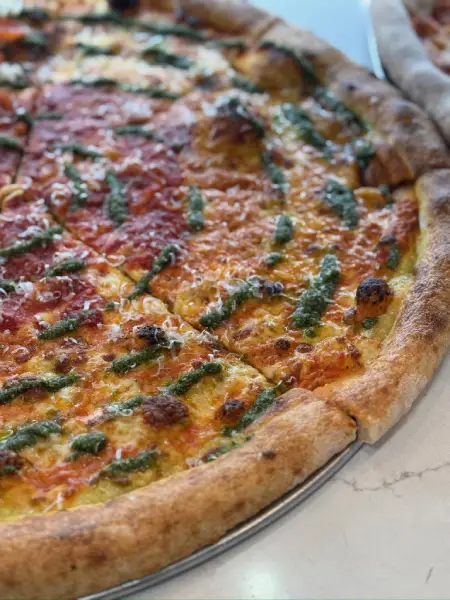 Crustinos Pizza supreme pizza, loaded with colorful toppings and baked golden.