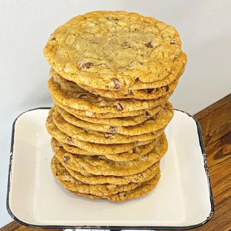 Freshly baked stack of chocolate chip cookies from The Meat Up Grill, offering a sweet and chewy treat