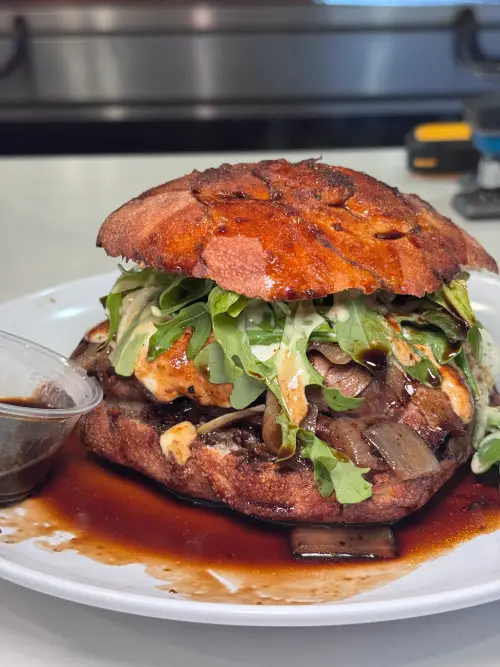 Crustinos Pizza’s signature sandwich with roasted vegetables and melted cheese.