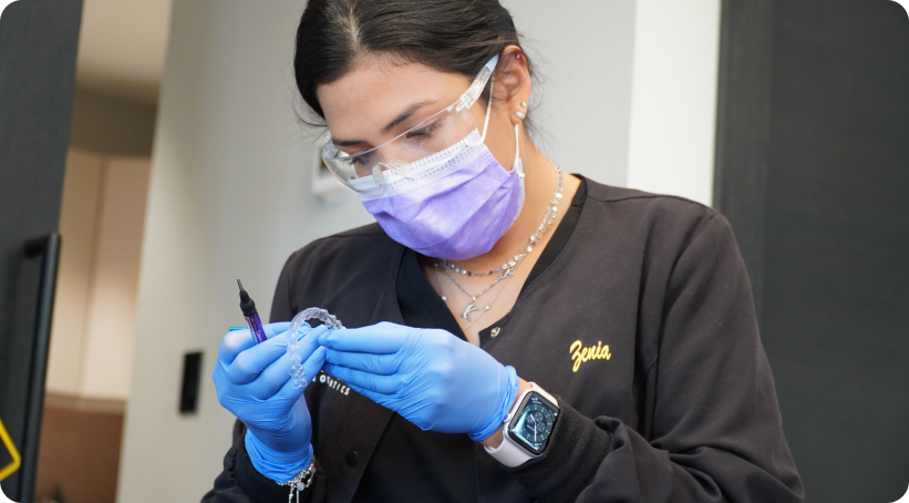 Woman inspecting invisalign