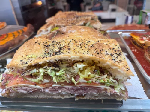 Rustic focaccia loaf at Crustinos Pizza, stuffed with greens and Italian flavors.
