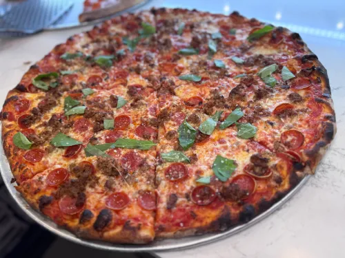 Classic cheese pizza from Crustinos Pizza, baked with a crispy crust and rich tomato sauce.