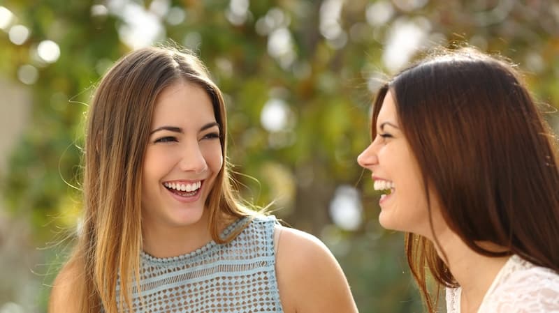 Confident patients smiling with healthy bright teeth after dental treatment – LIV Dentistry