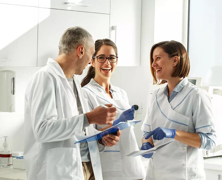 Experienced dental team discussing patient care and treatment plans – LIV Dentistry