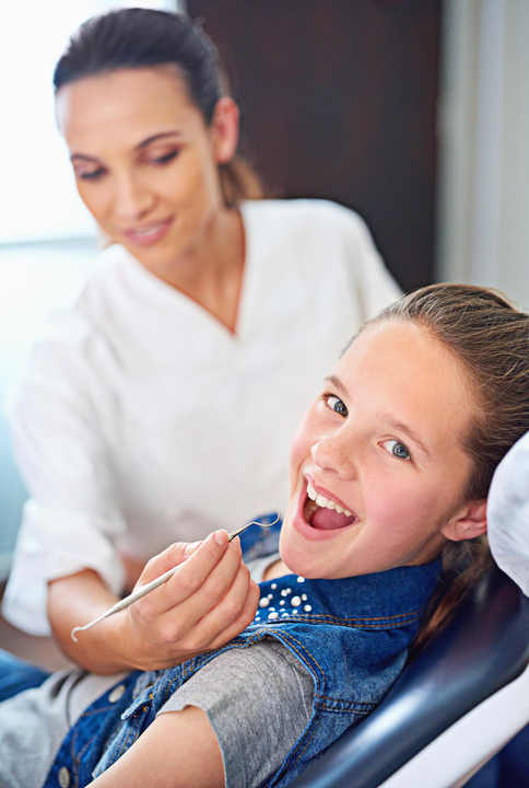 Happy child with dentist