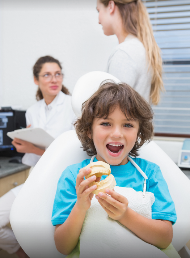 Happy child with dentist