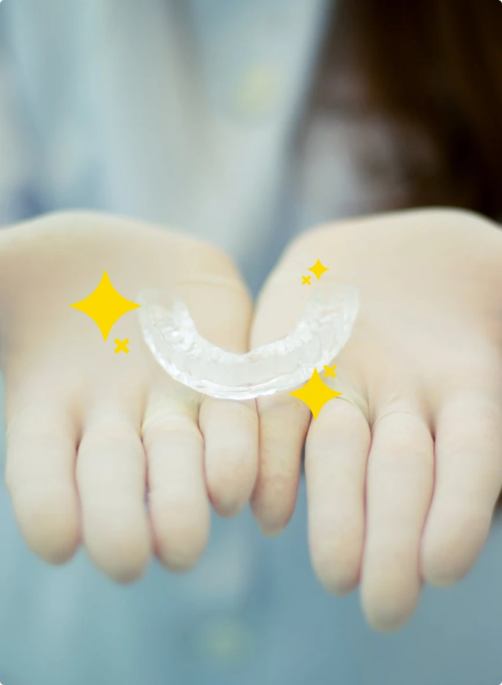 hand holding invisalign